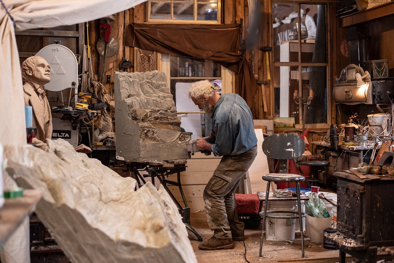 sculptor in studio working