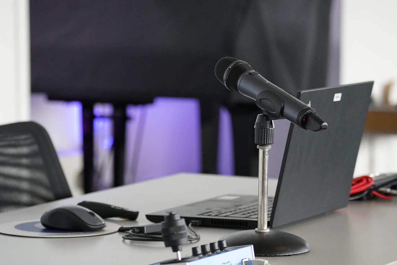 press microphone on desk